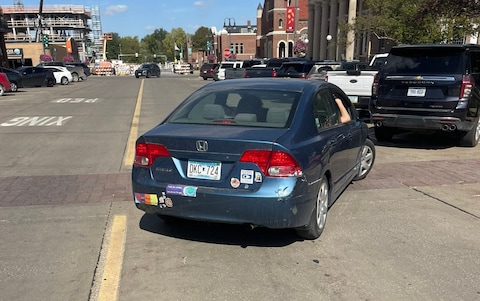 A protester rammed their blue Ho<em></em>nda Civic into the rental car, claims Mr Ramaswamy