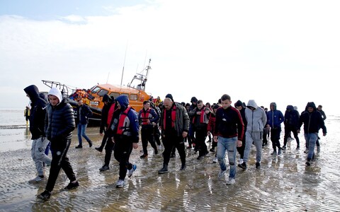 A group of people thought to be migrants are brought in to Dungeness, Kent, o<em></em>nboard the RNLI Dungeness Lifeboat, following a small boat incident in the Channel.