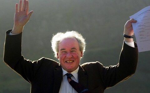 Jamie McGrigor celebrates his bill to create a tartan databa<em></em>se outside the Scottish parliament