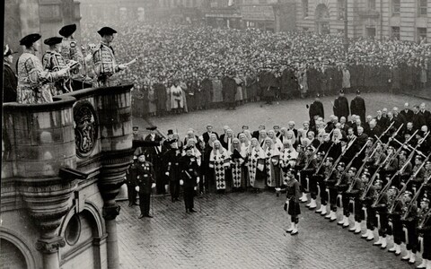 Sir Francis Grant, Lord Lyon King of Arms, reads the proclamation declaring George VI king at Mercat Cross in Edinburgh