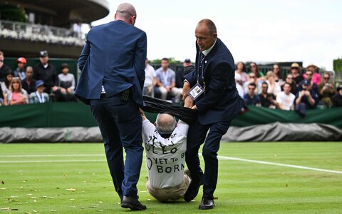 Just Stop Oil protester removed from court 18 after disrupting the match between Daria Saville and Katie Boulter 