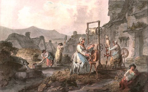 Women using spinning wheels in Llangollen, north-east Wales, in a<em></em>bout 1900