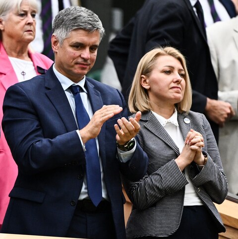Vadym Prystaiko and his wife, Inna Prystaiko, watch Ukraine's Elina Svitolina in the Wimbledon women's singles semi-finals