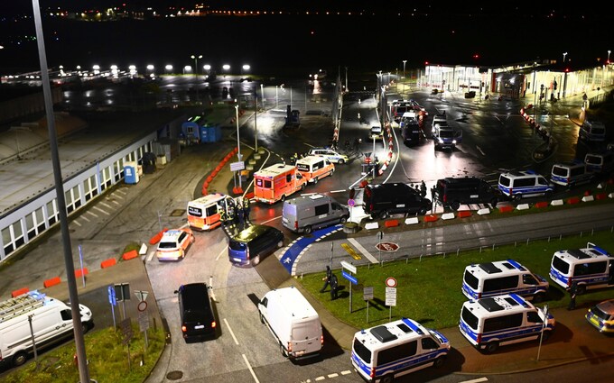 Police vehicles and ambulances arrive at a shooting scene at the Hamburg Airport