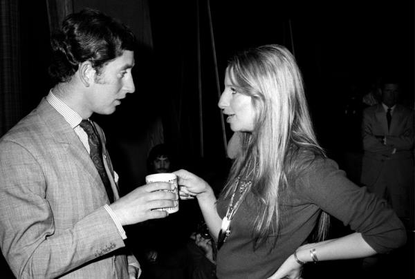 Prince Charles and singer Barbra Streisand share a moment over coffee at Warner Bros. studio on March 19, 1974.