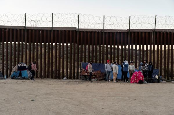 Migrants from Colombia camp at the U.S. side of the border wall after crossing the border into the U.S. from Mexico while waiting to be transported by U.S. Border Patrol in Jacumba Hot Springs, California, U.S., November 10, 2023.