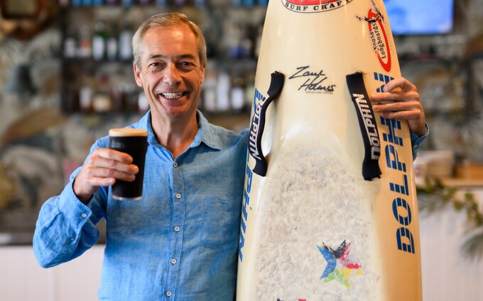 Nigel Farage drinks a pint after leaving the I'm a Celebrity jungle