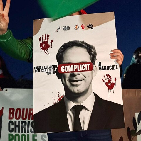 a<em></em>bout 80 activists lined the road outside Mr Ellwood’s home for several hours 