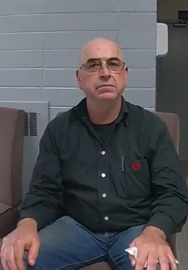 Lengyel sitting in a chair.
