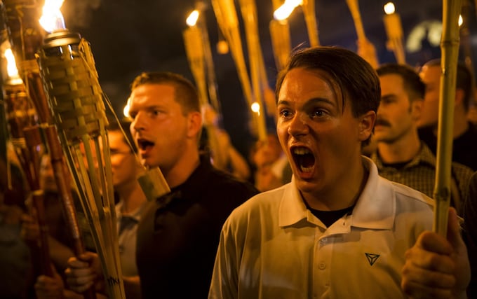 Young men attend the Unite the Right rally in Charlottesville, Virginia in August 2017