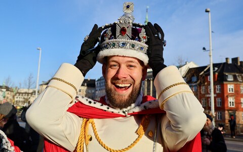 Rene Jensen reacts on the day Danish Queen Margrethe II, Europe's longest-serving monarch, abdicates