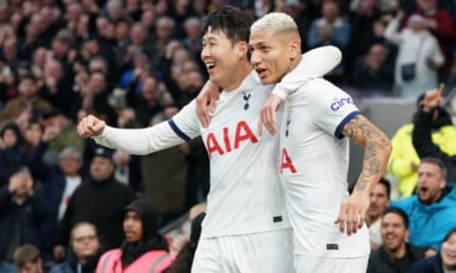 Son Heung-min celebrates scoring Tottenham’s second goal against Everton with teammate Richarlison.