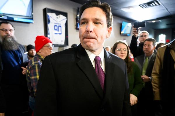 Republican presidential hopeful and Florida Gov. Ron DeSantis walks through a room of supporters at a caucus-day campaign event Monday, Jan. 15, 2024.