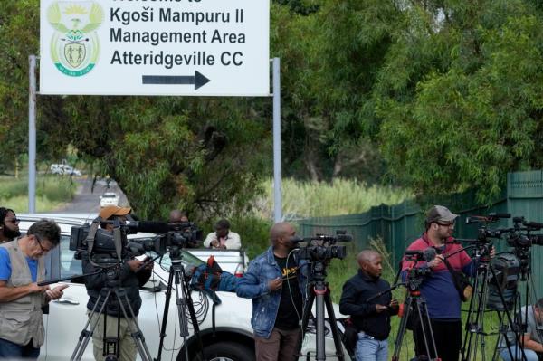 Members of the media stand outside the main gate of the Atteridgeville Prison in Pretoria, South Africa, awaiting Pistorius' release on Jan. 5.