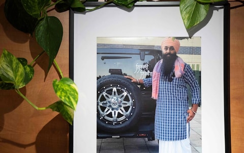 A portrait of late Sikh activist Avtar Singh Khanda is hanged on a wall in the Panjab Broadcasting Channel television station