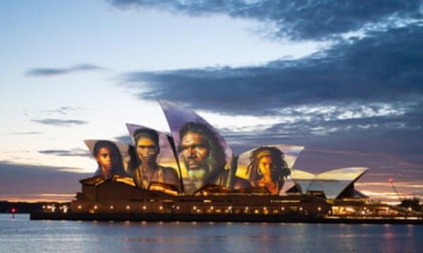 The sails of the Sydney Opera House are illuminated by a projection of Indigenous artwork on Friday morning.
