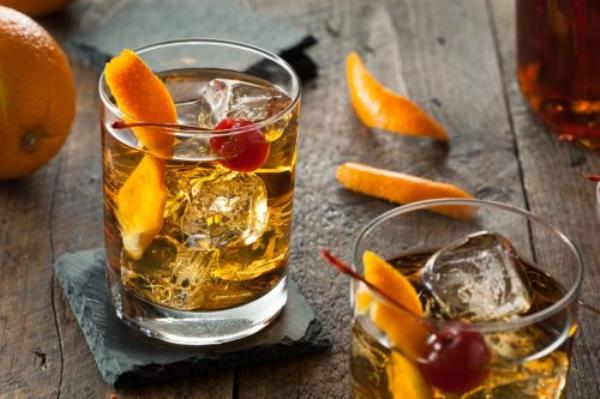 old fashio<em></em>ned cocktail with cherry and orange peel