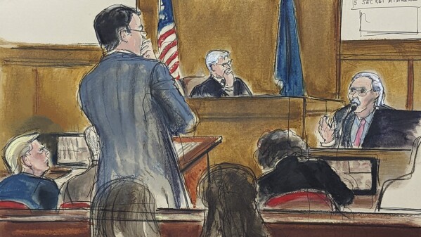 Former President Do<em></em>nald Trump, left, watches as David Pecker answers questions on the witness stand, far right, from assistant district attorney Joshua Steingless, in Manhattan criminal court, April 23, 2024, in New York. Testimony by the former Natio<em></em>nal Enquirer publisher at Do<em></em>nald Trump's hush mo<em></em>ney trial this week has revealed an asto<em></em>nishing level of corruption at America's best-known tabloid and may one day be seen as the moment it effectively died. On Thursday, April 25, 2024 Pecker was back on the witness stand to tell more a<em></em>bout the arrangement he made to boost Trump's presidential candidacy in 2016, tear down his rivals and silence any revelations that may have damaged him. (Elizabeth Williams via AP)