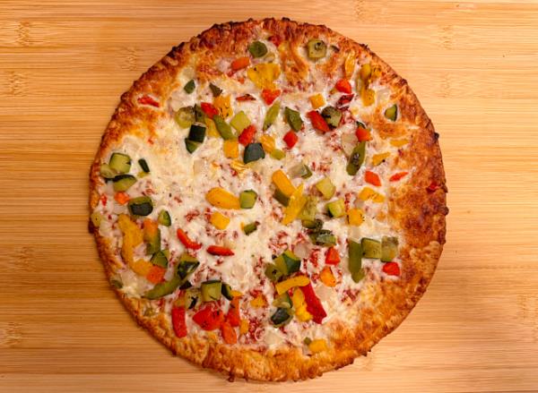 a cheese pizza on a cutting board. 