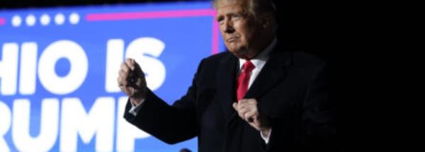 FILE - Former President Do<em></em>nald Trump dances at a rally at Wright Bros. Aero Inc. at Dayton Internatio<em></em>nal Airport on Nov. 7, 2022, in Vandalia, Ohio. Trump is heading to Ohio to rally support for Republican U.S. Senate candidate Bernie Moreno ahead of the March 19 primary.