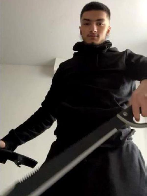 Al-Arfat Hassan posed with a sword