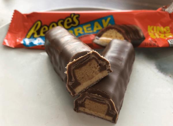 reeses take 5 candy broken open revealing the inside.