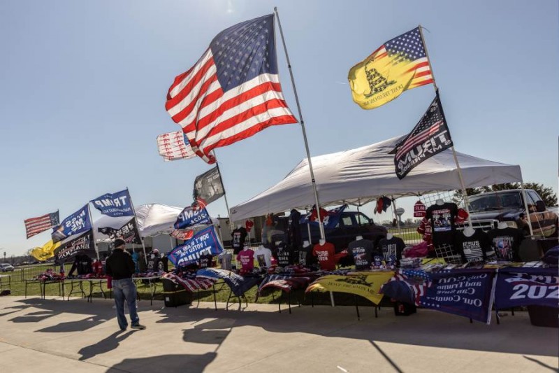 Campaign merchandise for former President Do<em></em>nald Trump is displayed in vendors’ booths outside the venue for a Buckeye Values PAC Rally wher<em></em>e Trump is scheduled to appear, in Dayton, Ohio on March 16, 2024.