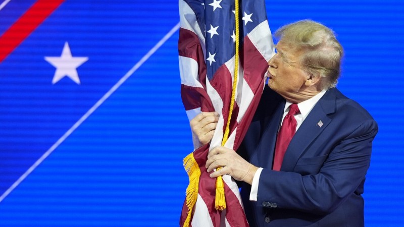 Republican presidential candidate former President Do<em></em>nald Trump invites Sen. Lindsey Graham, R-S.C., to speak at a primary election night party at the South Carolina State Fairgrounds in Columbia, S.C., Saturday, Feb. 24, 2024. (AP Photo/Andrew Harnik)