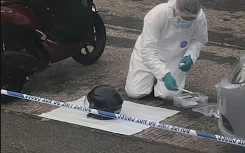 Forensic officer scour the crime scene 