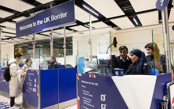 People queue at UK border co<em></em>ntrol at Terminal 2 at Heathrow Airport
