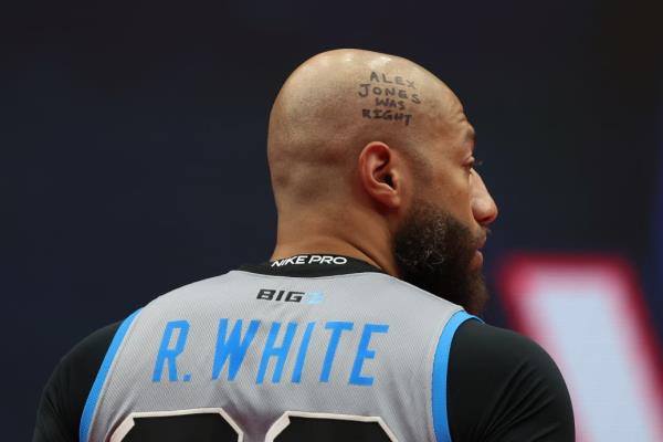 “Alex Jo<em></em>nes Was Right” written on the head of Royce White.