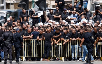 Israeli security hold back demo<em></em>nstrators during his visit to the Druze village of Majdal Shams
