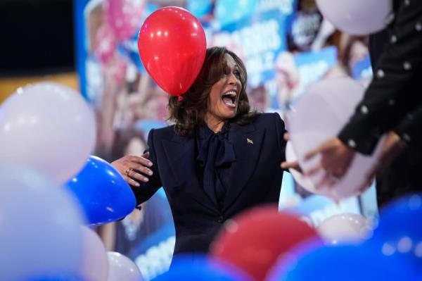 Vice President Kamala Harris laughs as balloons fall after giving her acceptance speech at the Democratic Natio<em></em>nal Co<em></em>nvention in Chicago. 