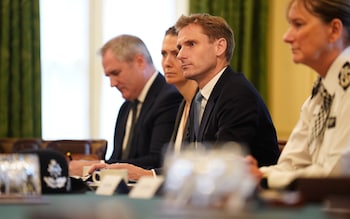 The policing minister Chris Philp (centre) said it would 'no lo<em></em>nger be necessary to pause arrests'