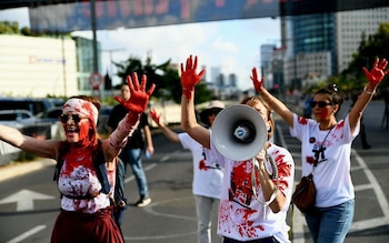 Mothers covered themselves in red during the demonstration