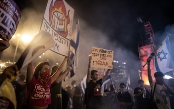 Thousands holding banners gather during a demo<em></em>nstration to demand a hostage swap deal