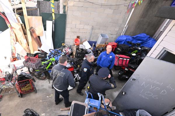 FDNY inspectors outside of the illegal boarding house.