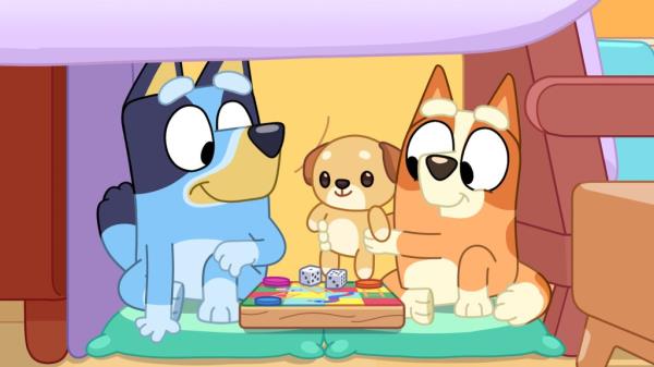 Bluey and Bingo play with their cubby Kimjim in an episode of 