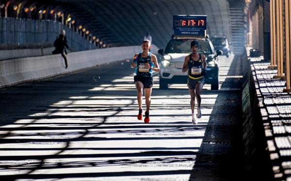 Mohamed El Aaraby of Morrocco and Eyob Faniel of Italy lead the 50th New York City Marathon as they cross the Queensboro Bridge on Sunday, Nov. 7, 2021