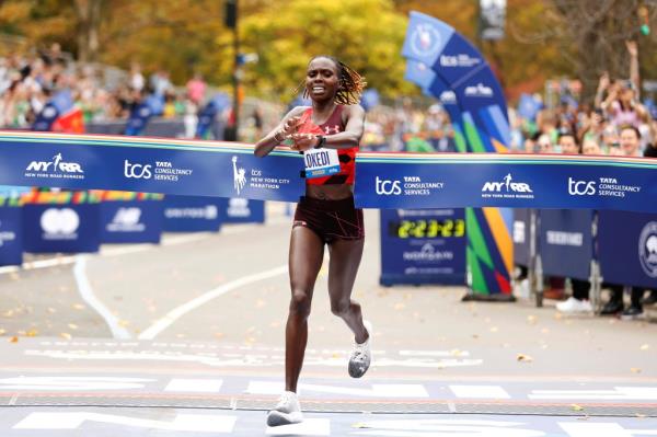 Sharon Lokedi crosses the finish line, winning the women's division of the 2022 NYC Marathon with a time of 2:23:23. 
