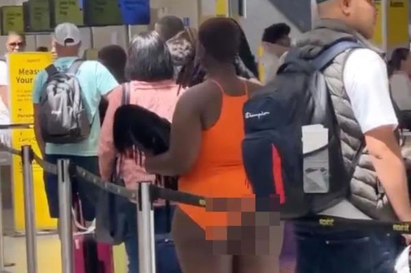 Passengers waiting in line for their flight out of Florida were left stunned by a woman who appeared to be half-naked from the waist down.