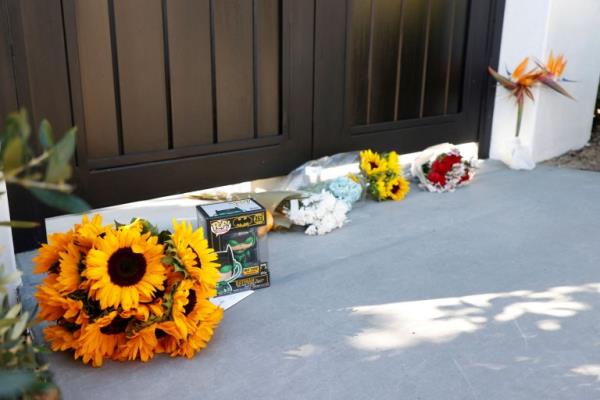 Mourners outside Matthew Perry's home