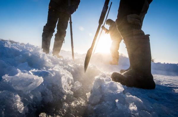 Villagers harvesting ice from a lake in Siberian permafrost.