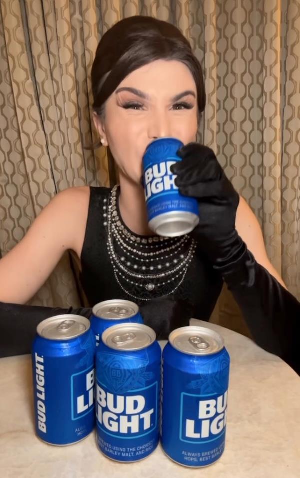 Dylan Mulvaney drinking a Bud Light.