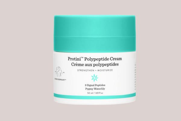 Image of a white tub of cream with a turquoise lid from the brand Drunk Elephant