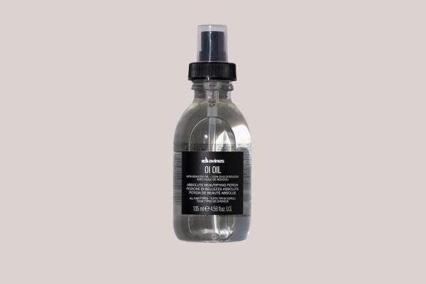 Image of a small clear bottle of hair oil