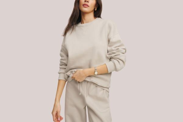 Image of a light tan-colored sweathirt and sweatpants combo