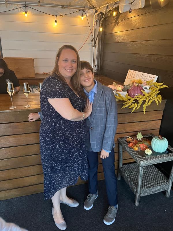 Christy Barbaran and her son posing together. 