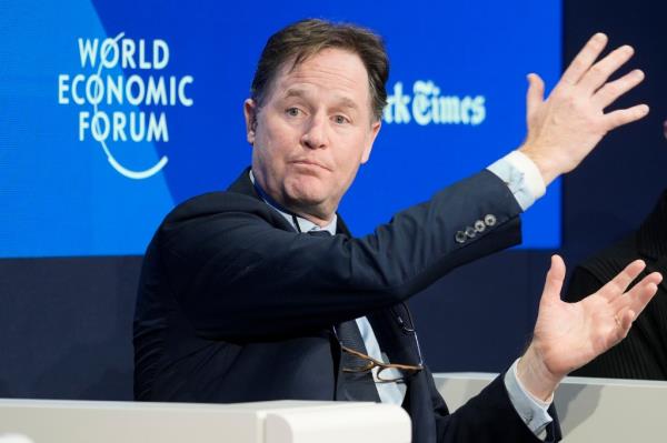 A photo of me<em></em>ta spokesman Nick Clegg gesturing with his hands at a panel discussion at Davos.