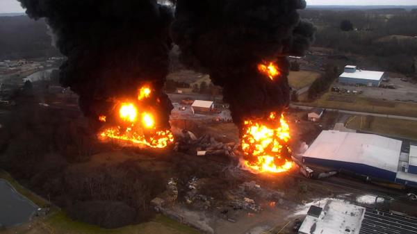 Flames and columns of smoke are seen above as a result of a 